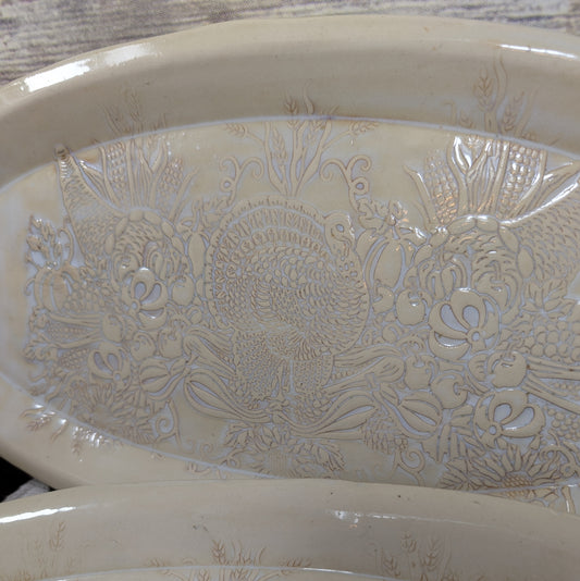 Decorative ceramic bowl with animal and food patterns on a wooden surface