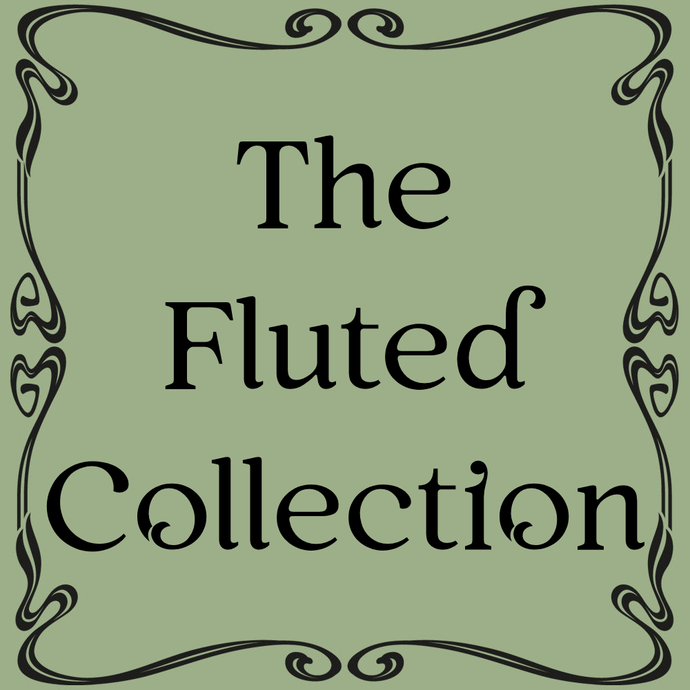 A collection of green and brown ceramics spread artistically on a stone stoop. 