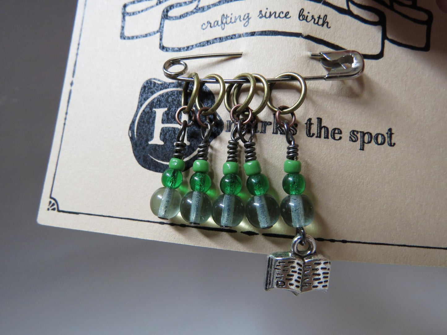 Book stitch marker set in green