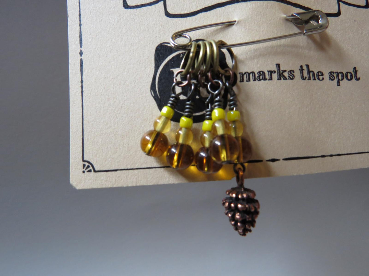 Pine cone stitch marker set in yellow