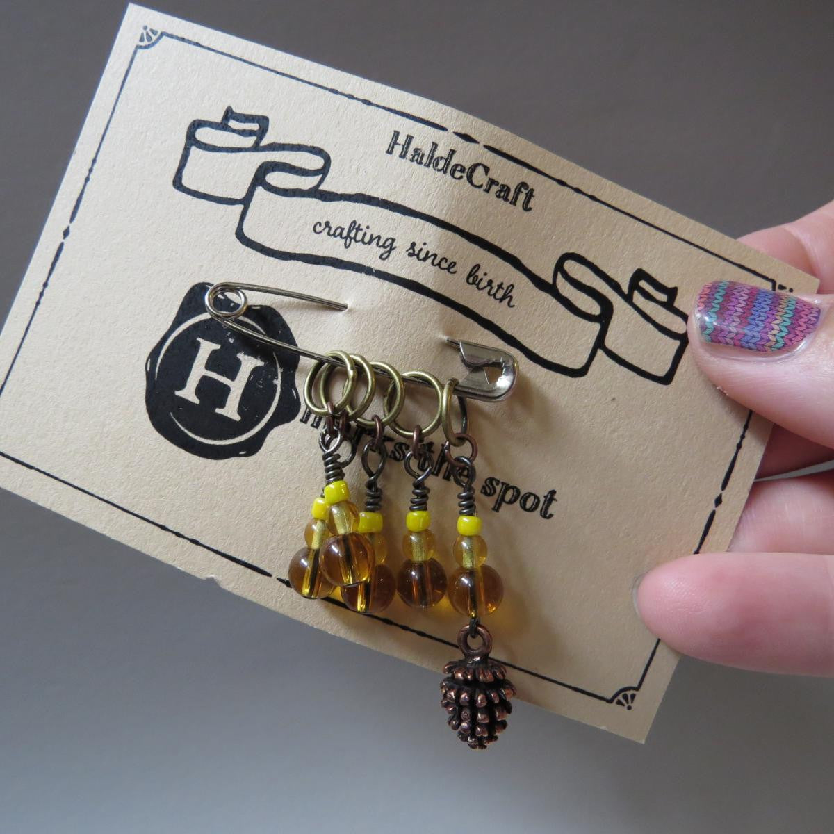 Pine cone stitch marker set in yellow