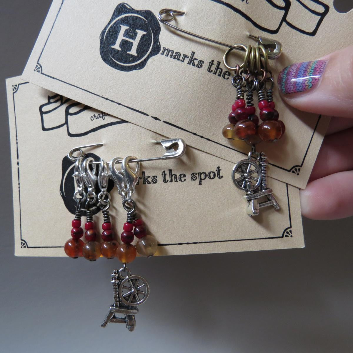 Spinning Wheel stitch marker set in red