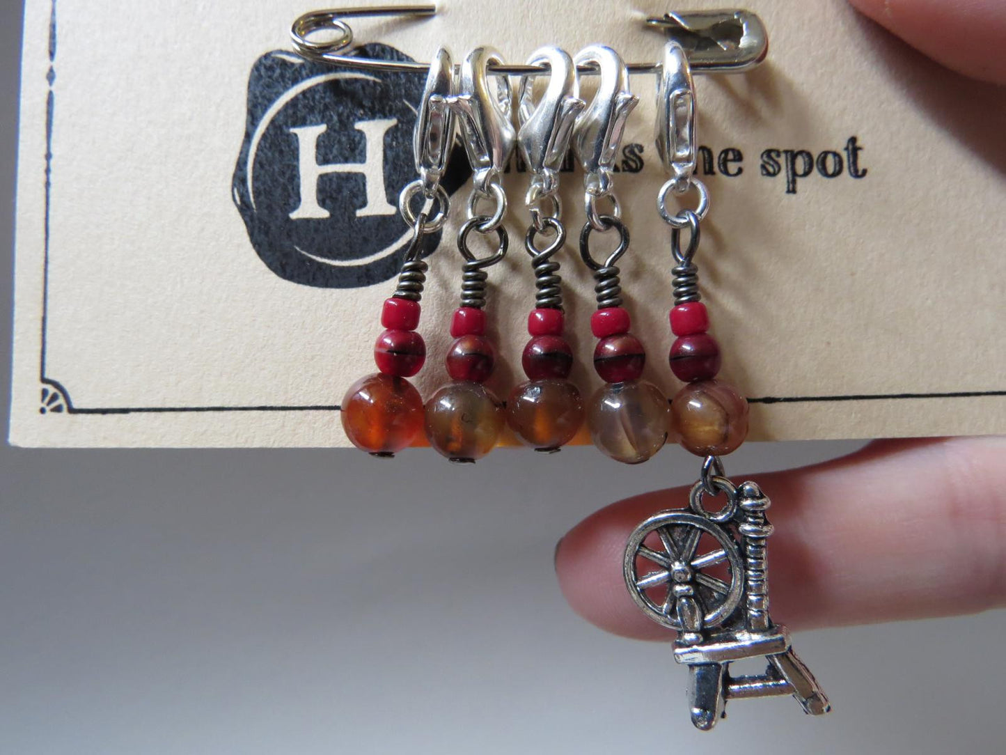Spinning Wheel stitch marker set in red