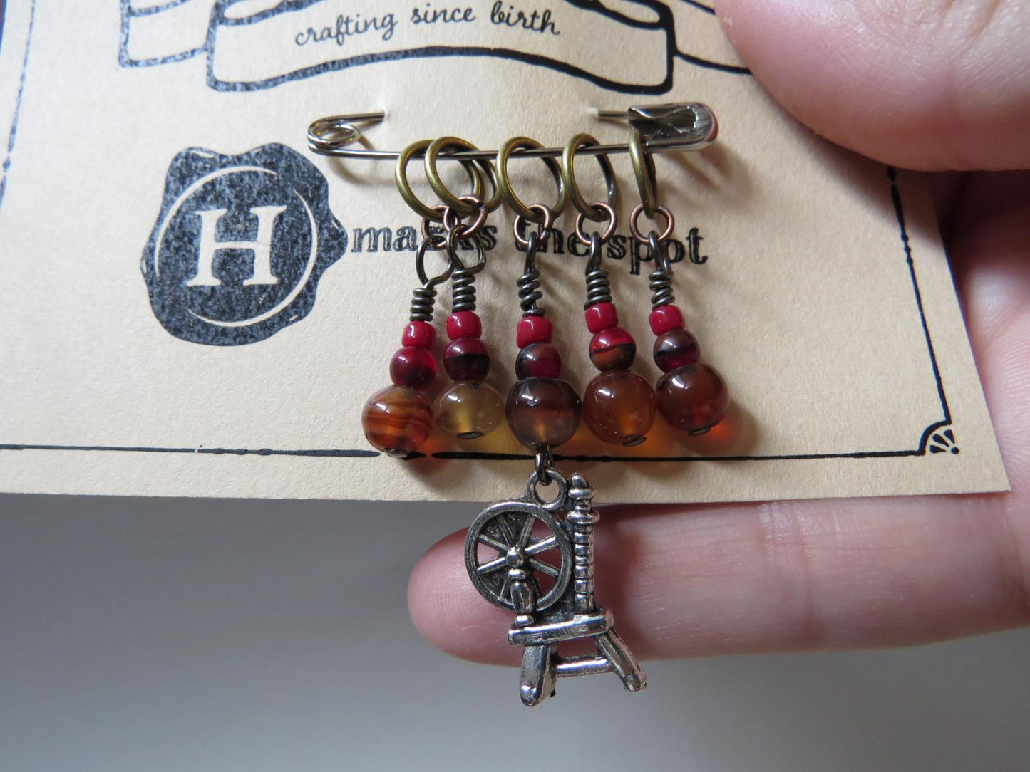 Spinning Wheel stitch marker set in red