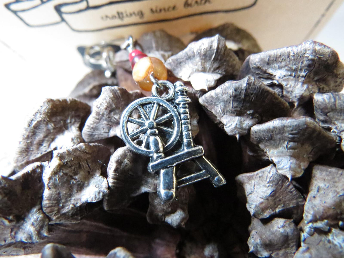 Spinning Wheel stitch marker set in red